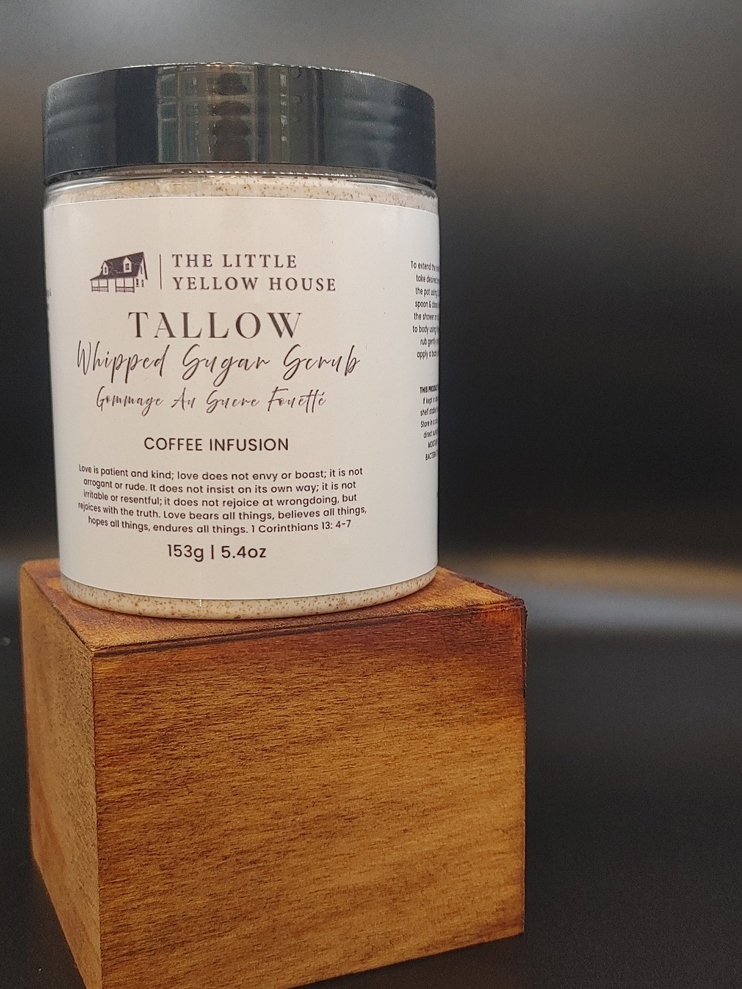 A close-up of a whipped tallow sugar scrub with a rich, creamy texture. Made with Vancouver Island grass-fed tallow and local coffee, the scrub shows fine sugar crystals and a light coffee tint