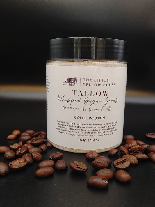 A close-up of a whipped tallow sugar scrub with a rich, creamy texture. Made with Vancouver Island grass-fed tallow and local coffee, the scrub shows fine sugar crystals and a light coffee tint